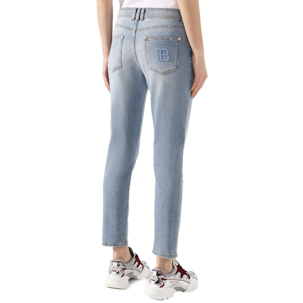 Balmain – light blue regular jeans – rear view worn with embroidered back pocket logo