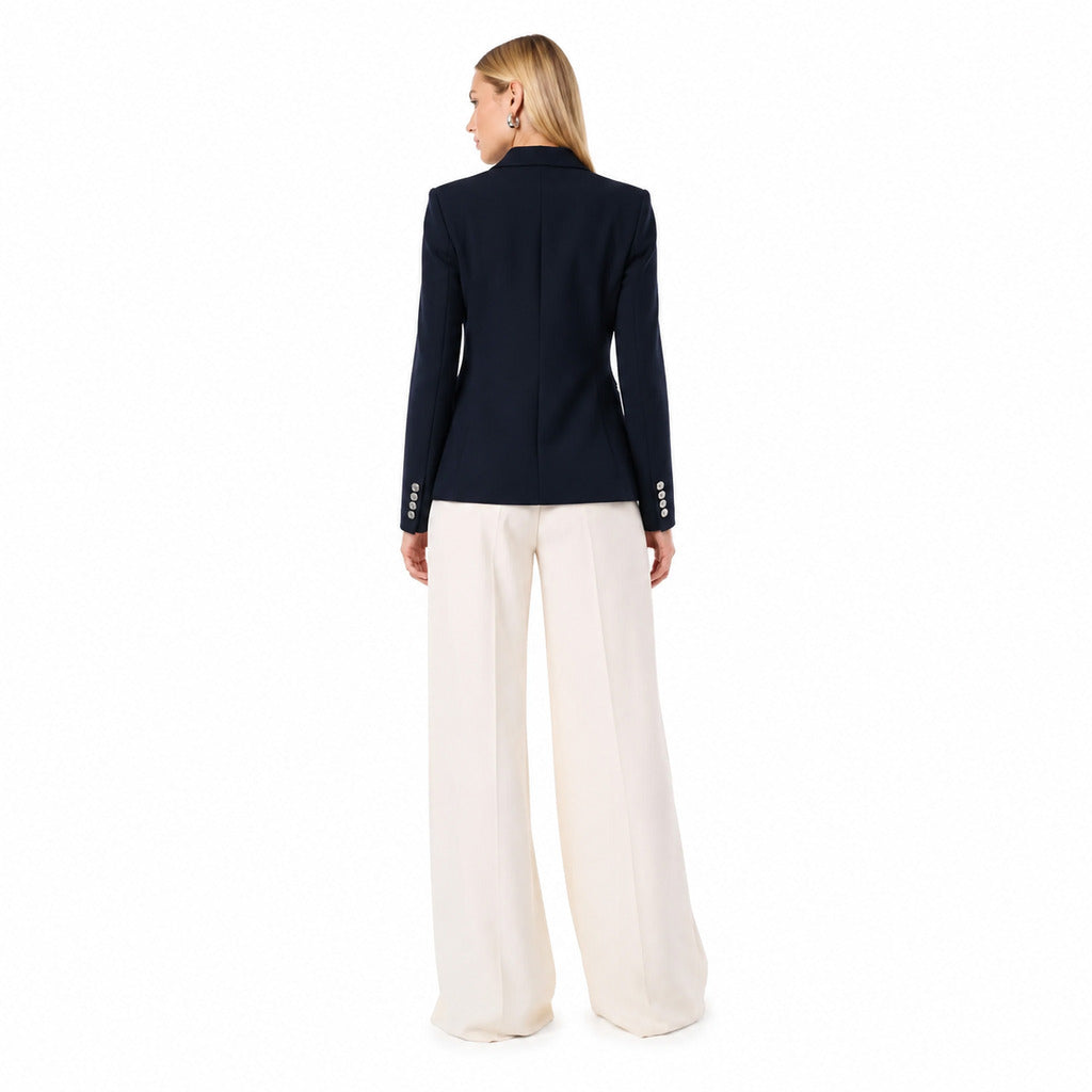 Pinko – navy double-breasted tailored jacket – back view worn with white trousers