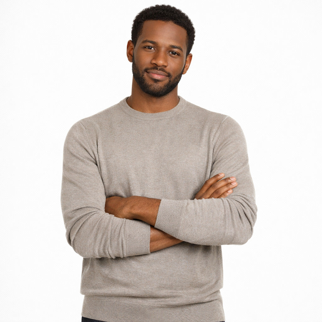 Emilio Romanelli – beige cashmere crewneck sweater – front view worn with arms crossed