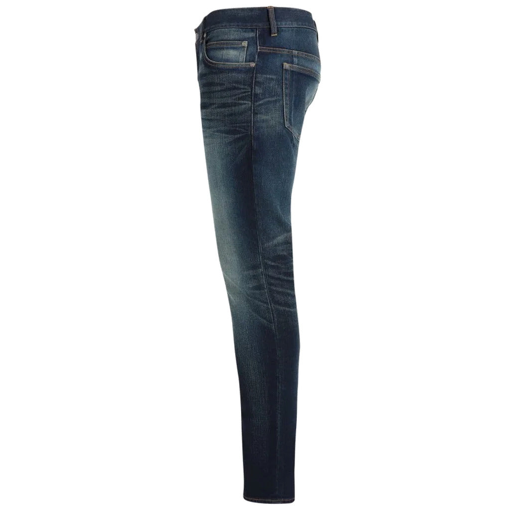 Balmain – blue cotton skinny jeans – side profile showing tapered leg and faded denim