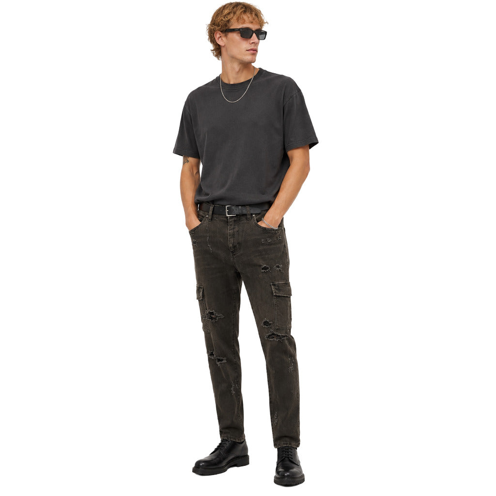 Dolce & Gabbana – black denim cargo trousers – front view worn with distressed details
