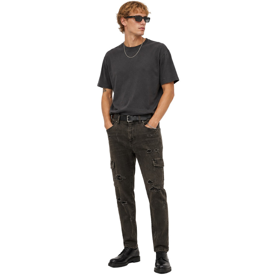 Dolce & Gabbana – black denim cargo trousers – front view worn with distressed details