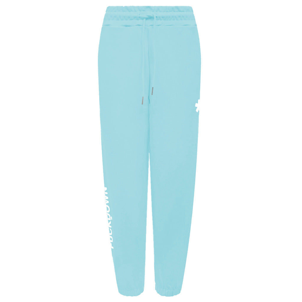 Comme Des Fuckdown – Printed Fleece Pants – Flat front view in light blue with drawstring and printed logos