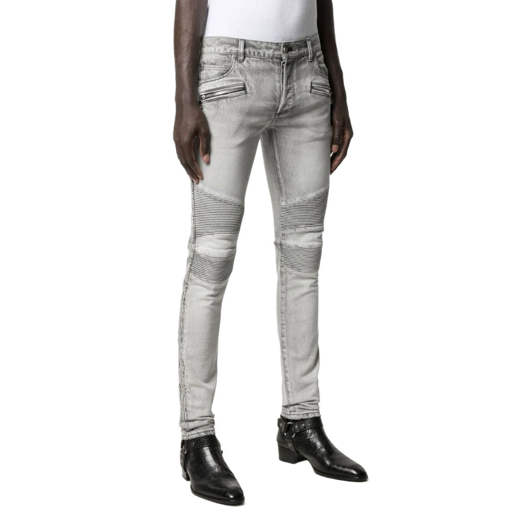 Balmain – grey slim-fit jeans – front view worn with ribbed knees and zip pockets