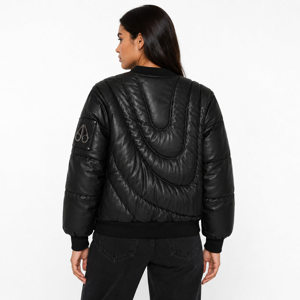 Moose Knuckles – black padded jacket – model wearing it from the back, showing curved quilting