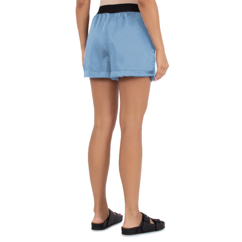 Comme Des Fuckdown – light blue shorts with black waistband – worn from the back