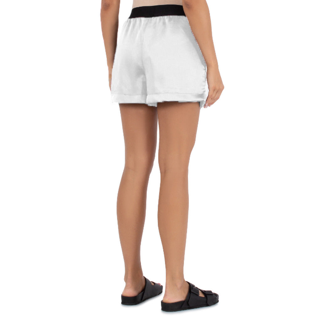 Comme Des Fuckdown – white modal shorts – back view worn on a model