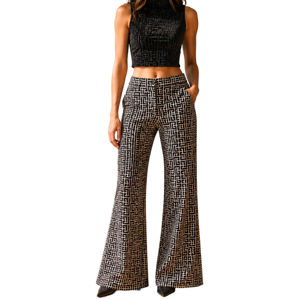 Balmain – black patterned flared trousers – front view worn with a matching cropped top