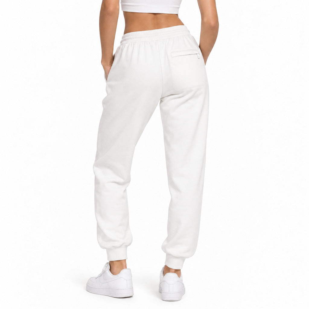 Dolce & Gabbana – white logo track pants – model wearing them from behind