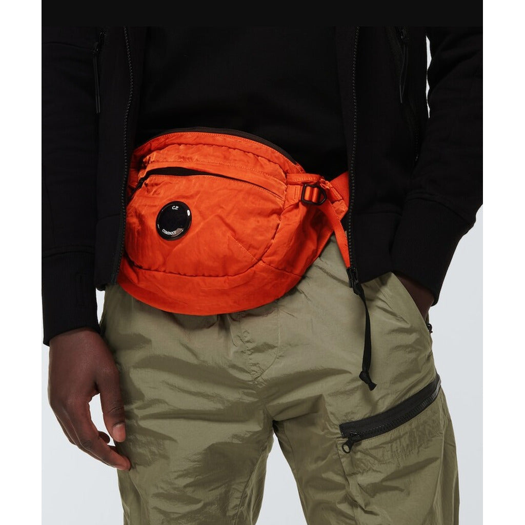 C.P. Company – orange nylon blend belt bag – worn across the waist with black jacket