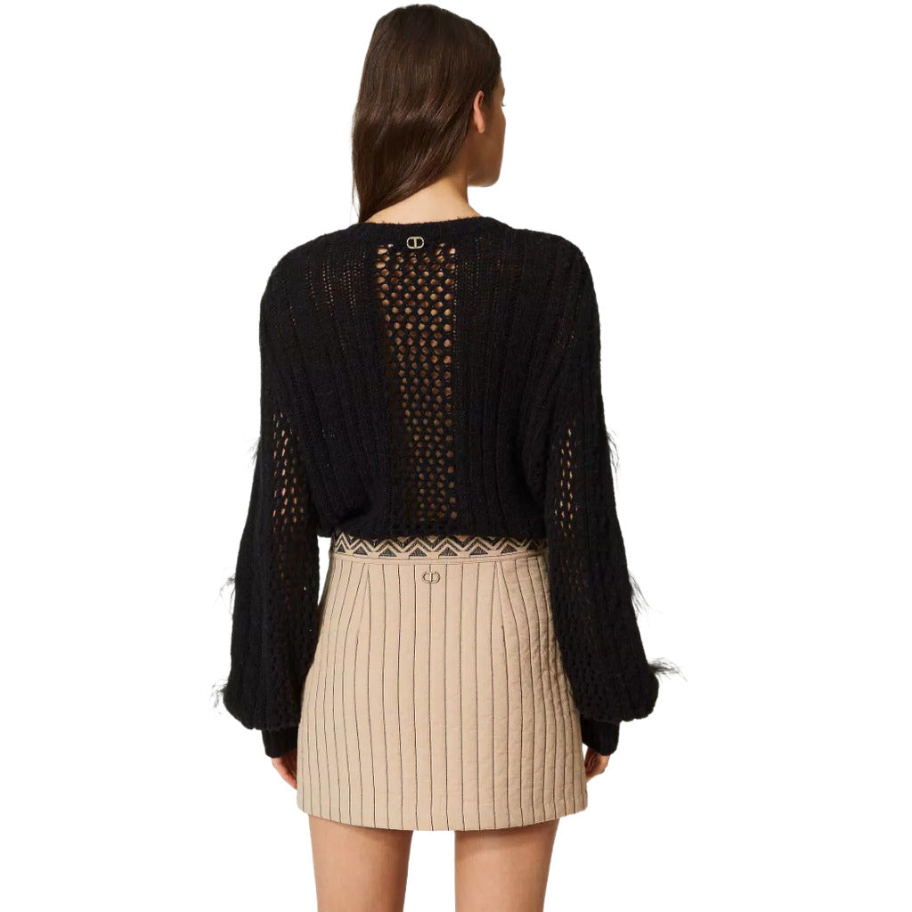 Twinset – beige quilted miniskirt – back view worn with black sweater