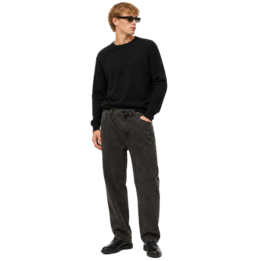 Dolce & Gabbana – black denim trousers – front view on model