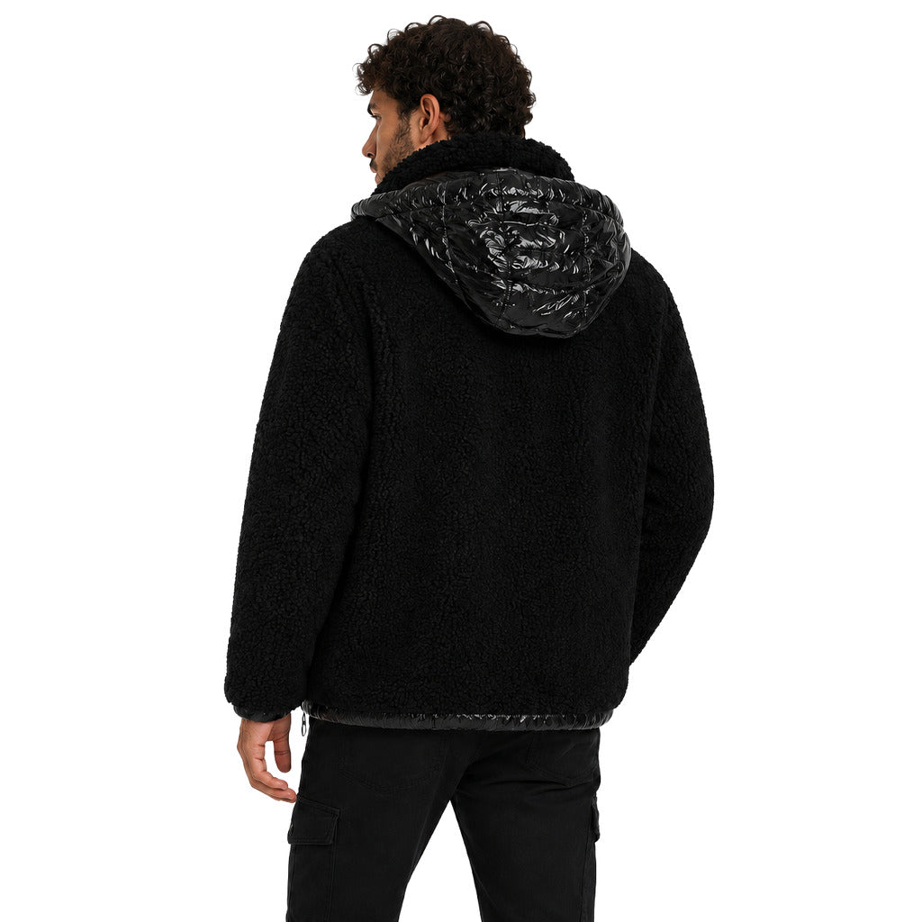 Moose Knuckles – black sherpa jacket with hood – rear three-quarter view worn by male model