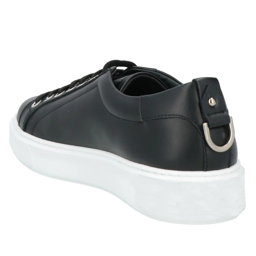Les Hommes – M Tesinice Low-Top Sneakers in Black – Rear three-quarter view with silver heel detail
