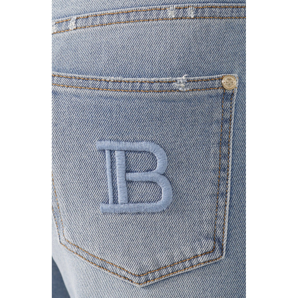 Balmain – light blue regular jeans – close-up of denim texture and embroidered back pocket