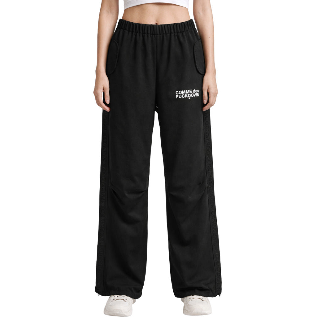 Comme Des Fuckdown – black wide-leg logo trousers – model wearing them from the front