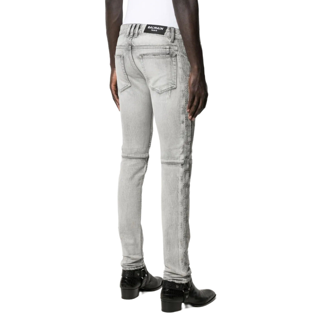 Balmain – grey slim-fit jeans – rear three-quarter view worn with back pockets visible