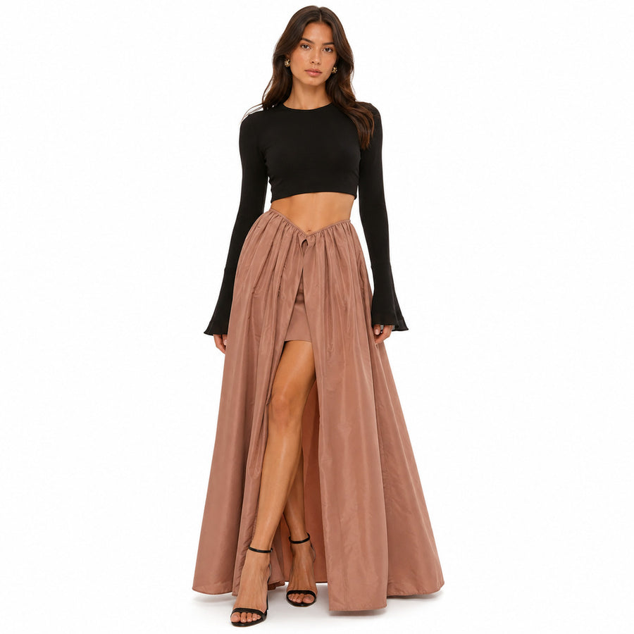 Pinko – brown pleated maxi skirt – front view with long slit and model wearing black top