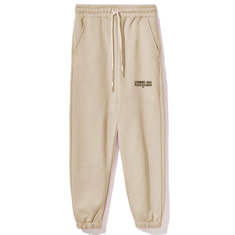 Comme Des Fuckdown – Sweatpants in Beige – Front flat lay with drawstring pockets and logo