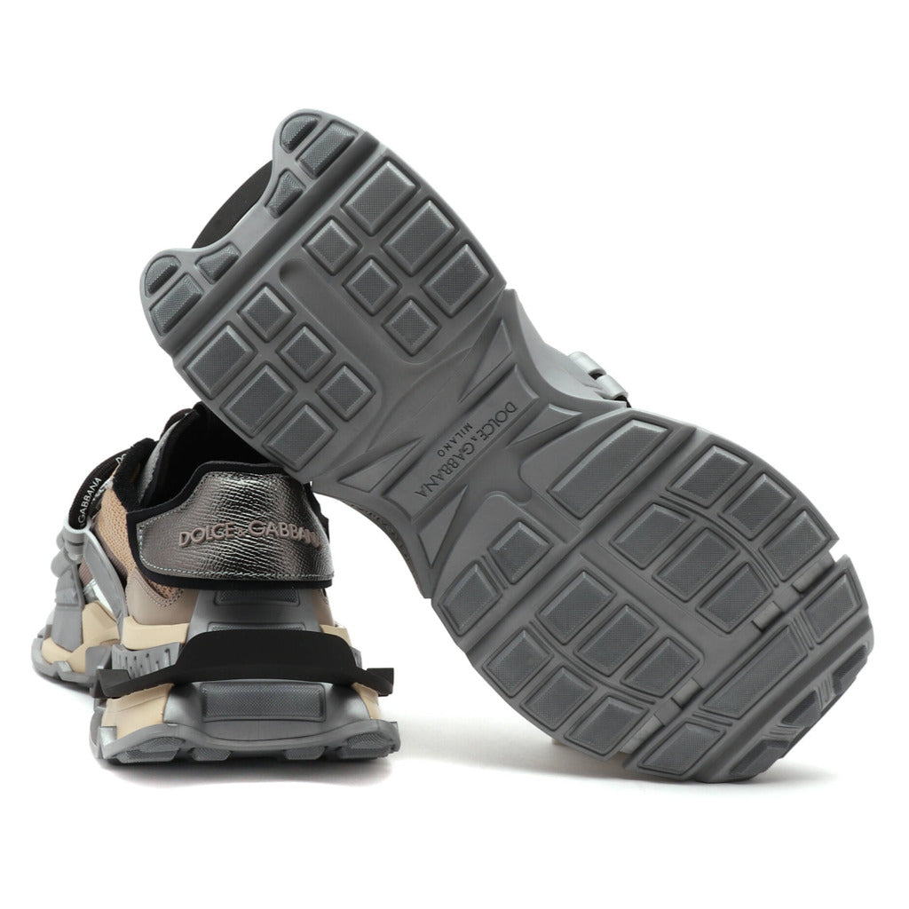 Dolce & Gabbana – grey fabric low-top sneakers – sole view showing geometric tread beside rear shoe