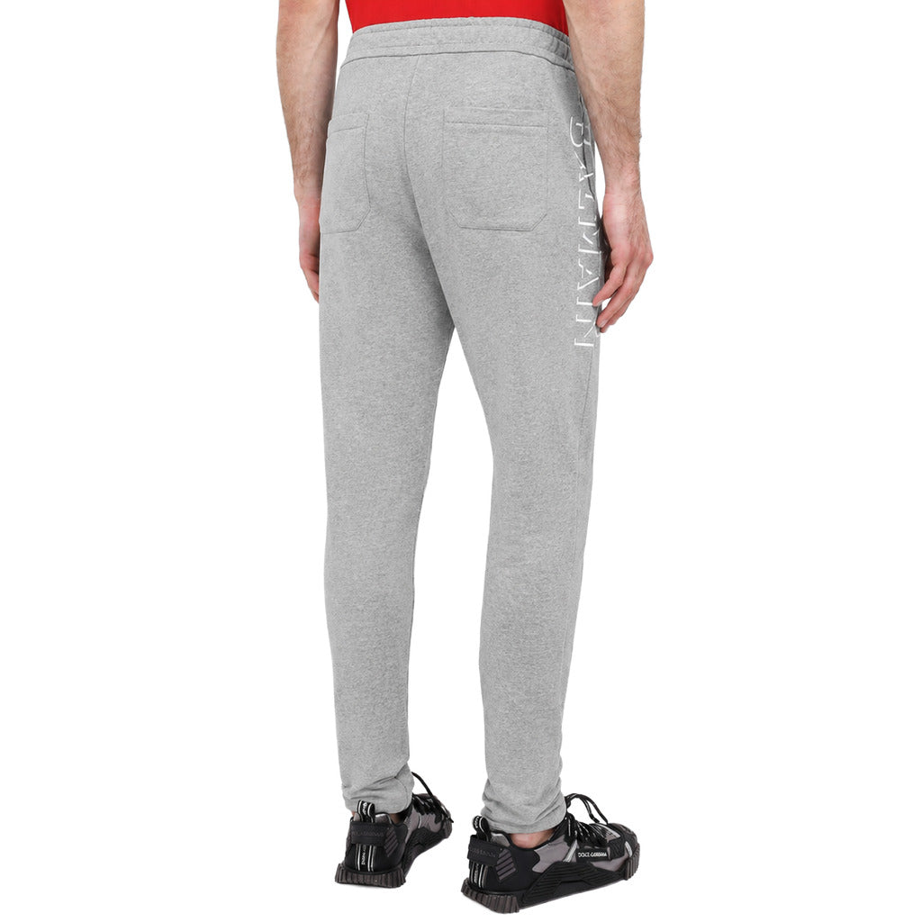Balmain – heather grey cotton joggers – rear view worn with back pockets and side lettering
