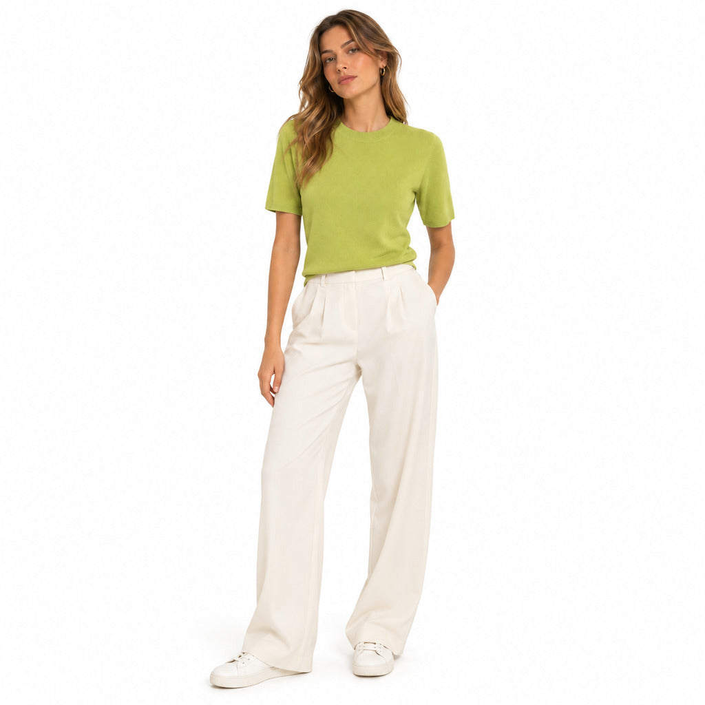 Anna Molinari – lime green crew-neck T-shirt – worn with cream trousers, front view