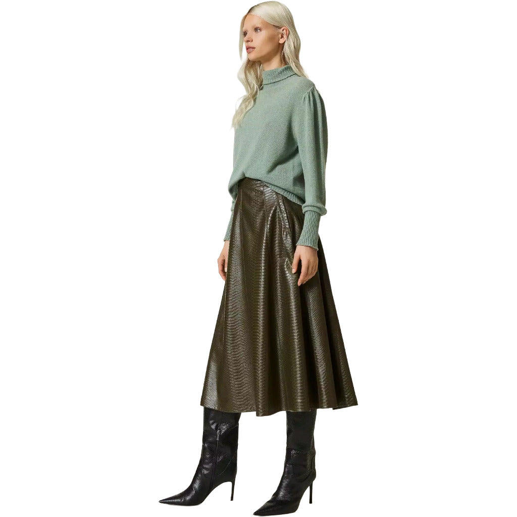 Twinset – green animal-print midi skirt – model wearing the skirt with a sage sweater and black boots