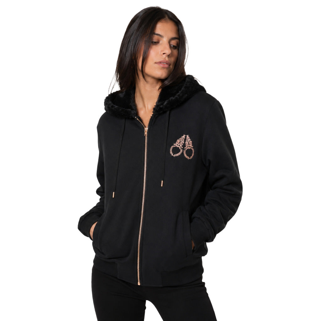 Moose Knuckles – black fleece-lined hoodie – worn three-quarter front view with pockets