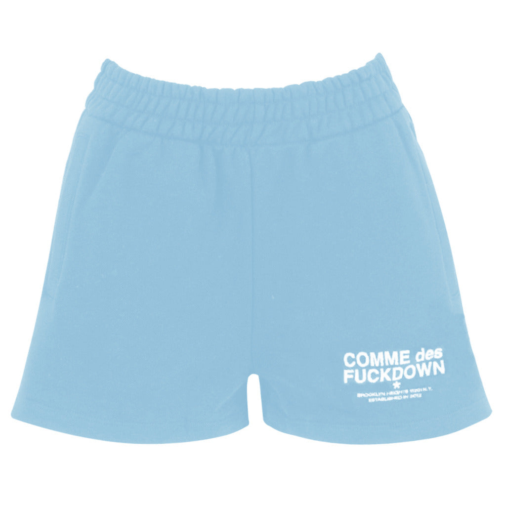 Comme Des Fuckdown – light blue cotton shorts – front flat lay with white logo