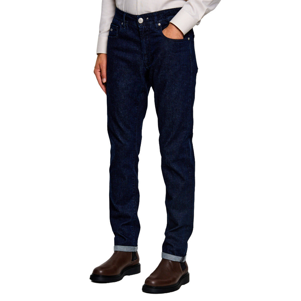 Tramarossa – Michelangelo Blue Raw R-Elax Jeans – front view worn with rolled cuffs and brown boots
