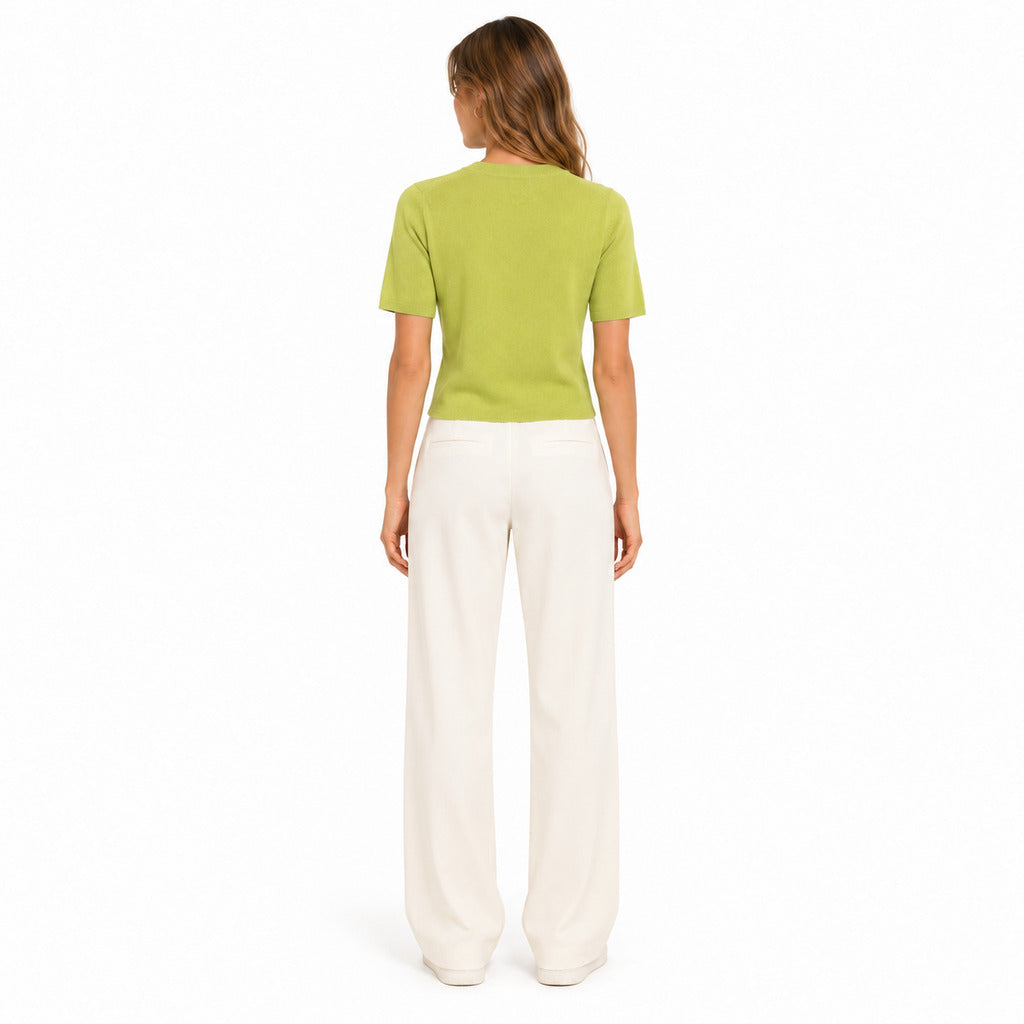 Anna Molinari – lime green crew-neck T-shirt – worn with cream trousers, back view