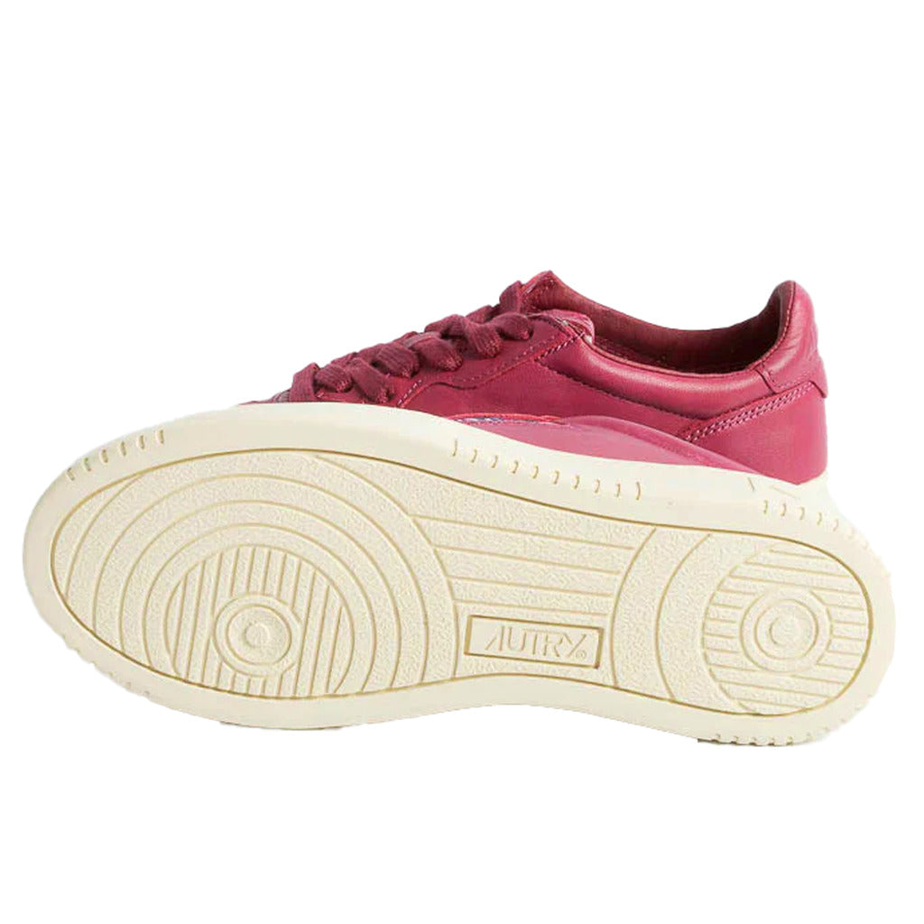Autry – Dallas sneakers – Fuchsia sneaker shown sole-up with circular tread pattern