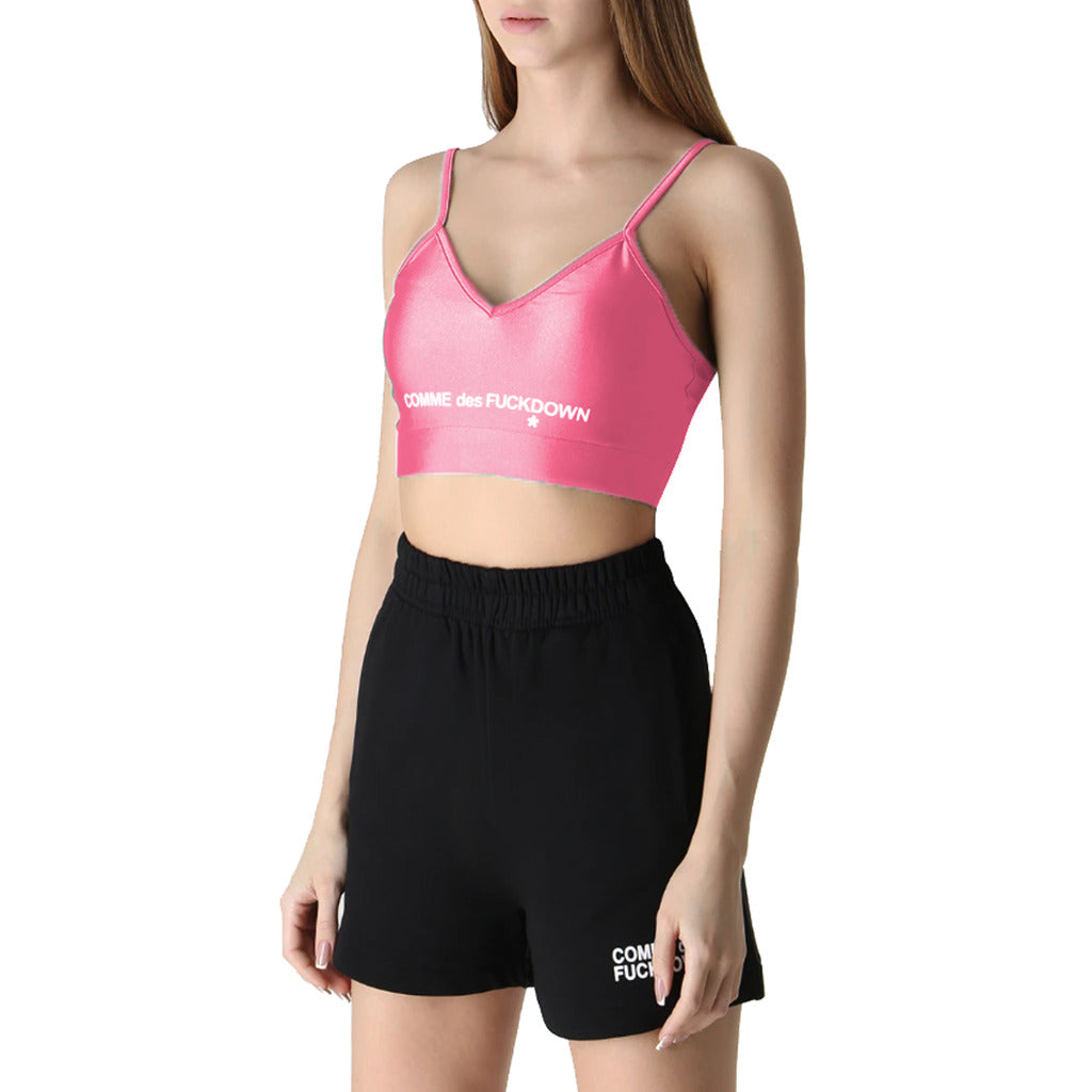 Comme Des Fuckdown – Glossy Lycra Top – Pink logo top worn with black shorts