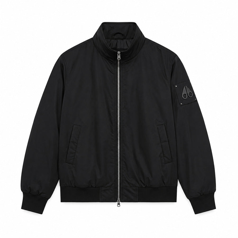 Moose Knuckles – black windproof jacket – front flat lay with raised collar and zip