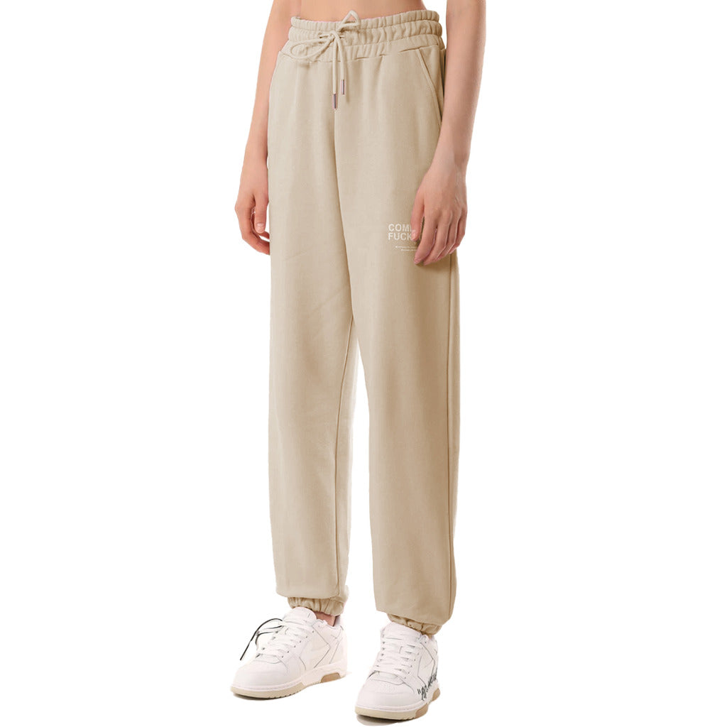 Comme Des Fuckdown – beige sweatpants – front view worn with drawstring waist visible