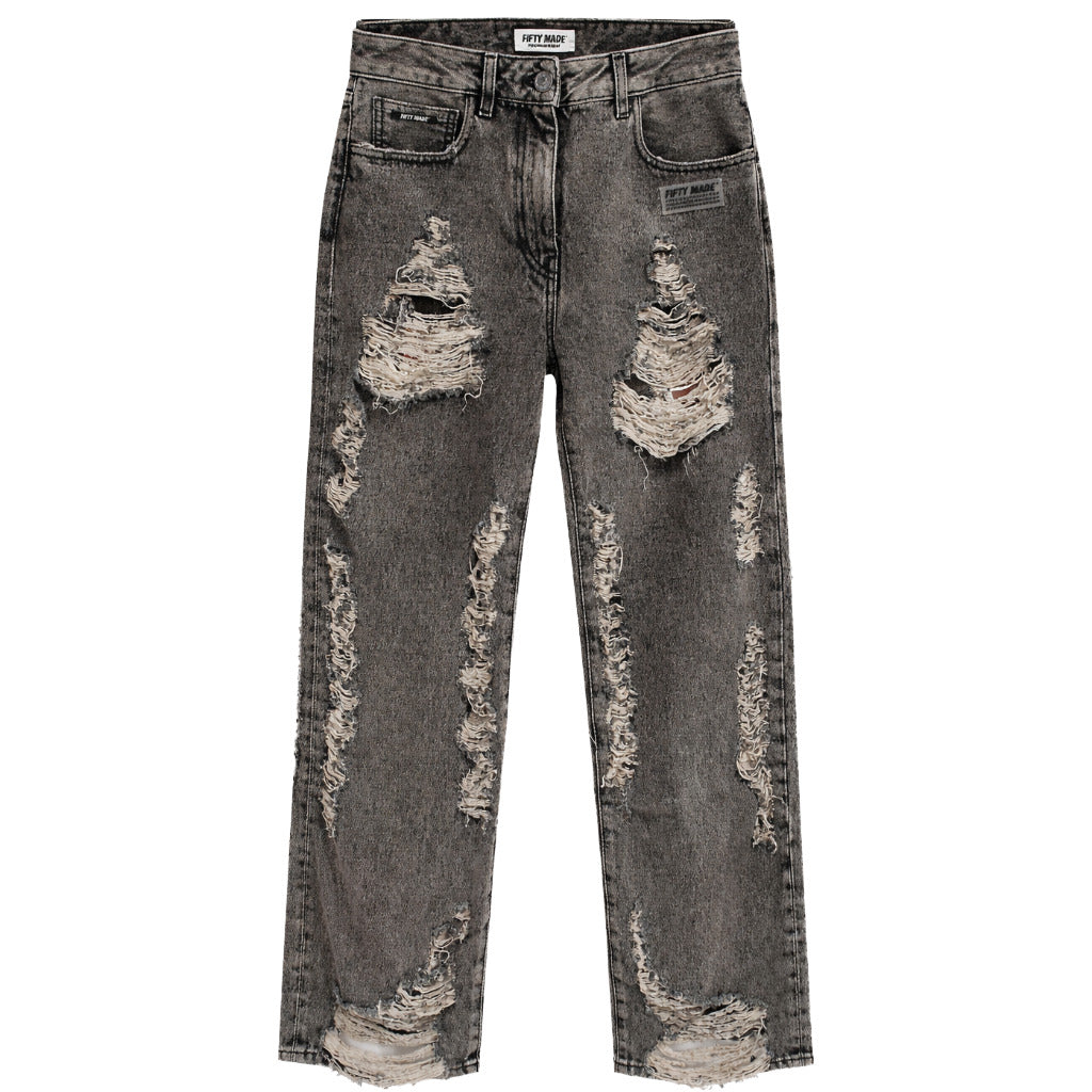 Fifty Made – black distressed jeans – front flat lay with extensive frayed rips