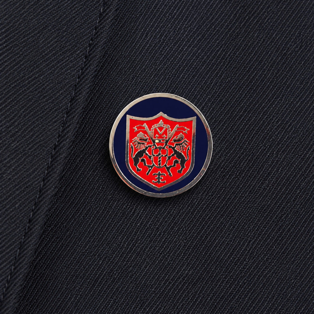 Dolce & Gabbana – blue double-breasted formal jacket – close-up of crest button and fabric