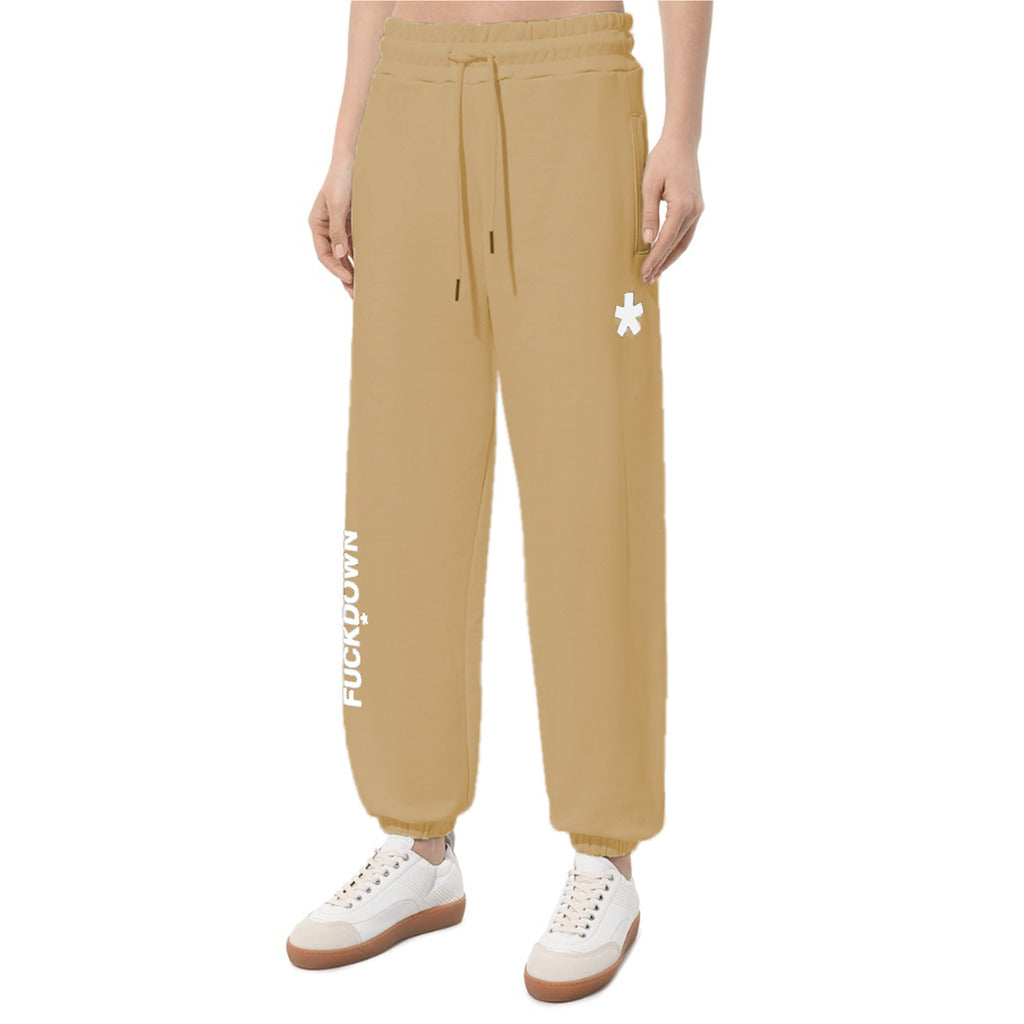 Comme Des Fuckdown – Printed Fleece Pants – Front view worn in tan with drawstring, pockets and printed logos
