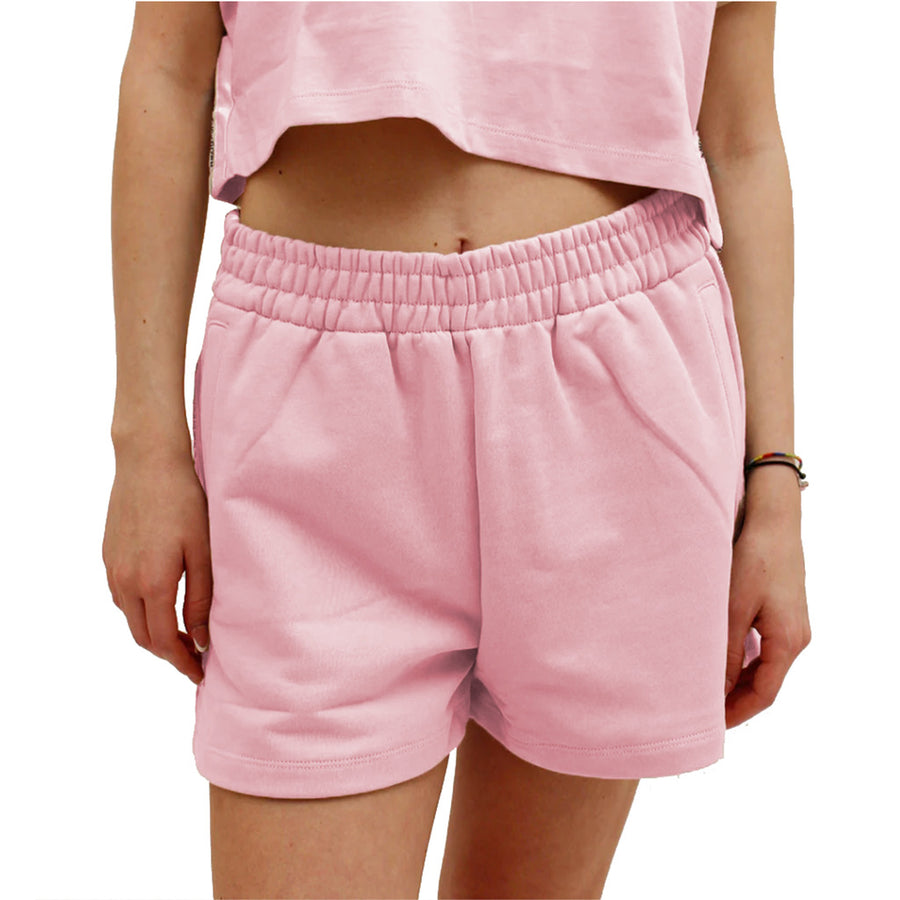 Comme Des Fuckdown – Shorts with Side Bands – front view of pink shorts worn