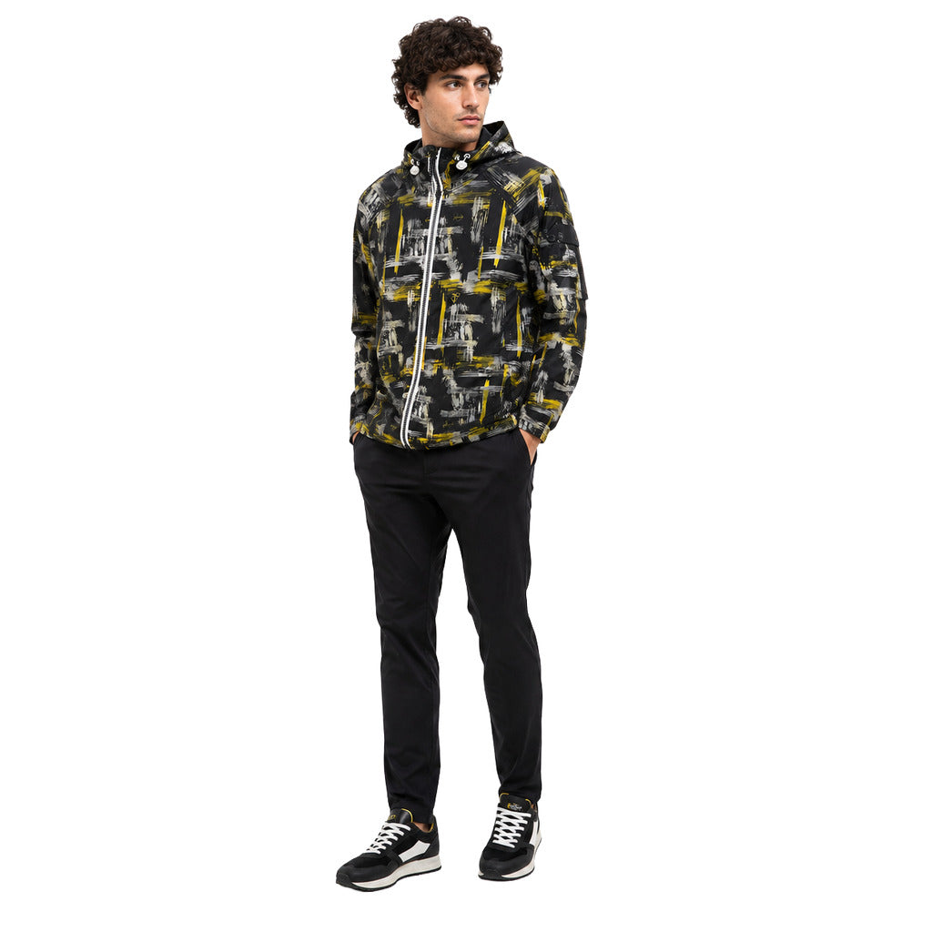 Moose Knuckles – Plamondon black hooded jacket – model wearing it, front three-quarter view