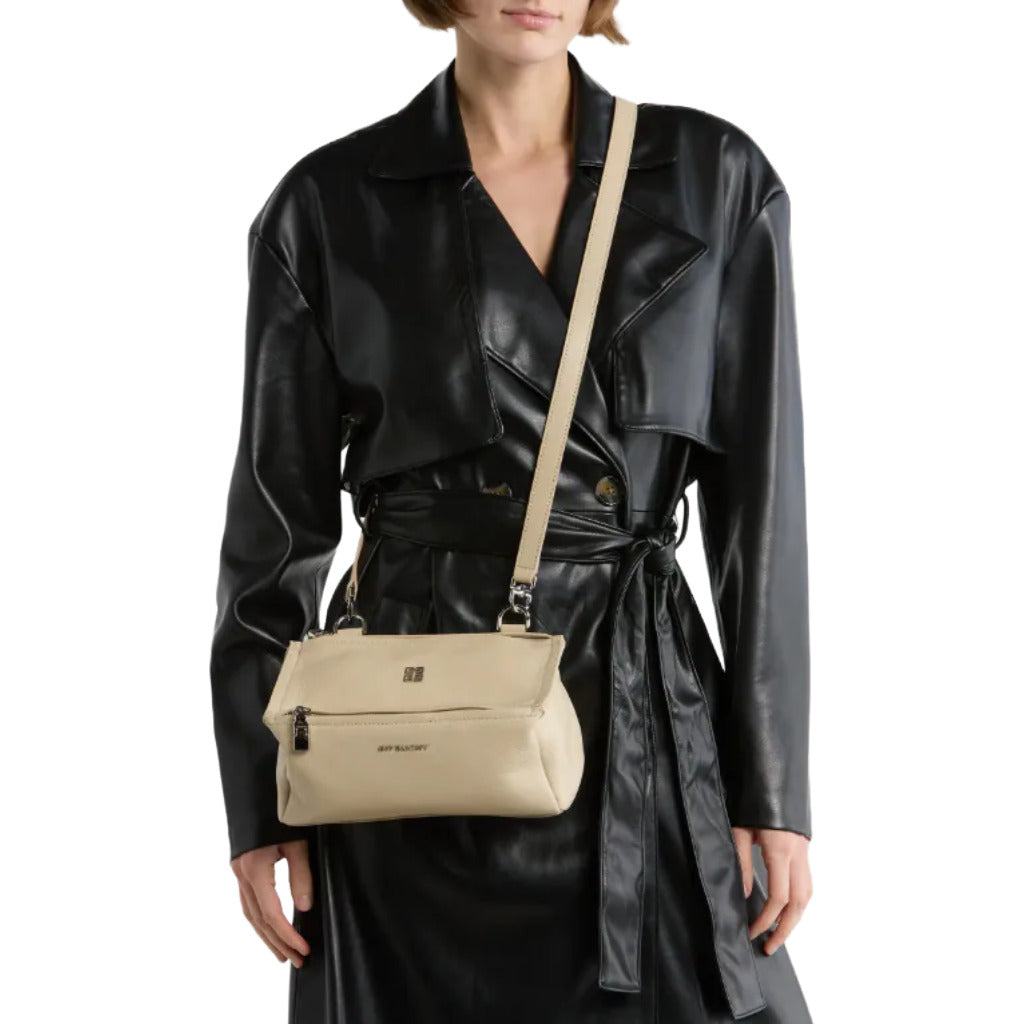 Givenchy – beige calfskin Pandora Mini crossbody bag – worn crossbody against a black coat