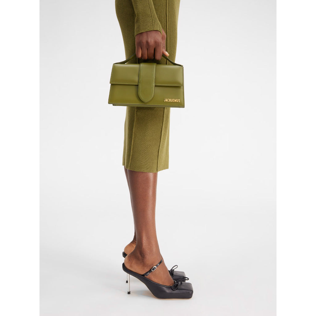 Jacquemus – Le Grand Bambino Shoulder Bag – carried by hand with green outfit
