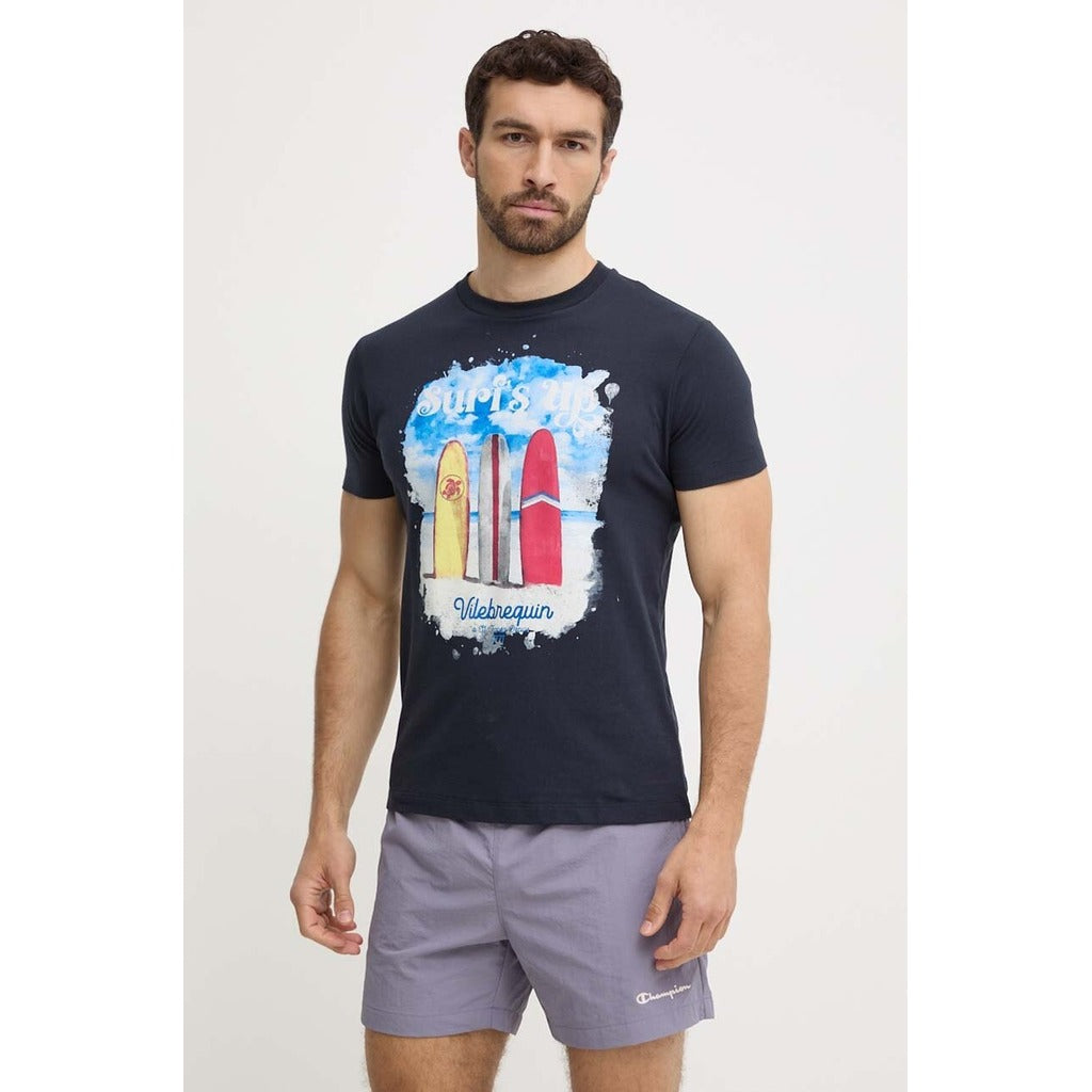 Vilebrequin – navy Surf's Up graphic T-shirt – worn from the front with lilac shorts