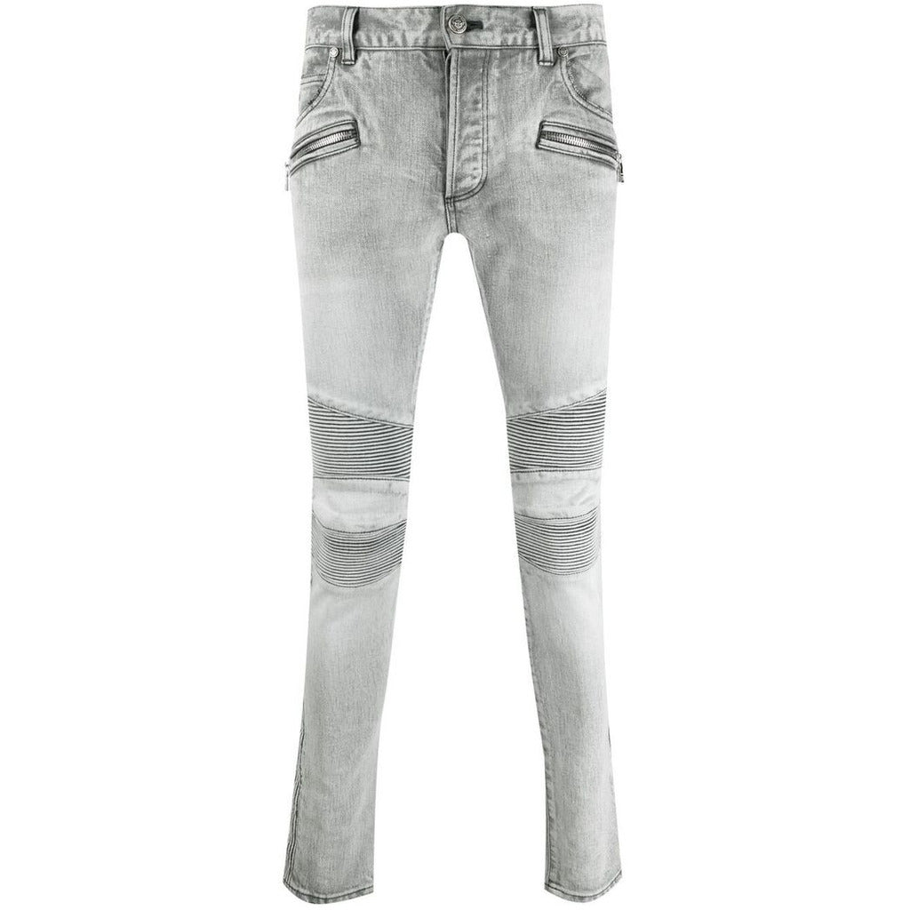 Balmain – grey slim-fit jeans – front flat lay showing ribbed knee panels and zip pockets