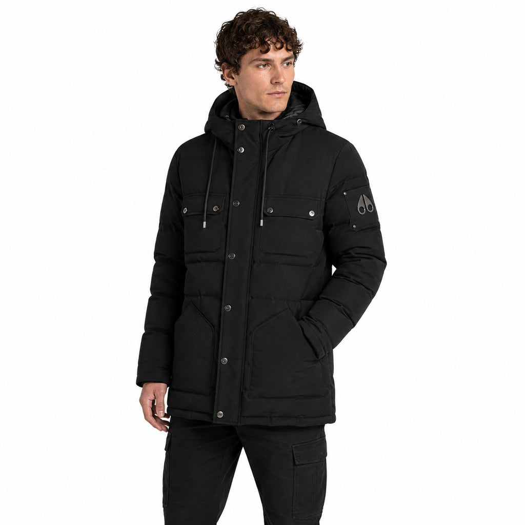 Moose Knuckles – black quilted jacket with hood – model wearing it from the front