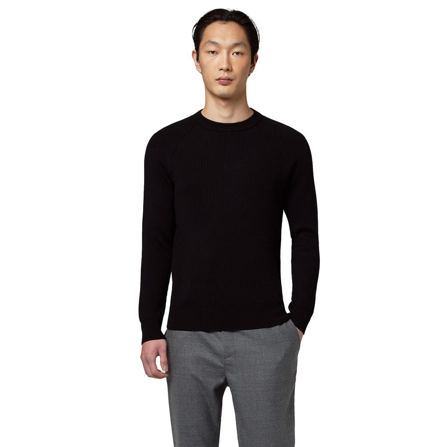 Alpha Studio – black ribbed merino crew neck sweater – front view worn with grey trousers