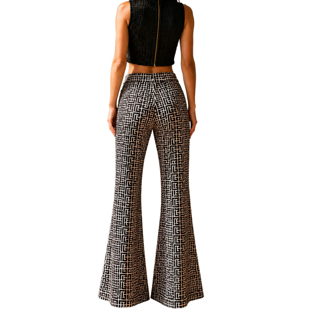 Balmain – black patterned flared trousers – back view worn with a matching cropped top
