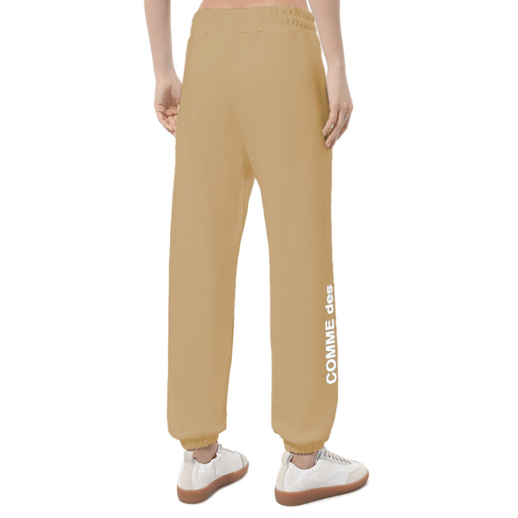 Comme Des Fuckdown – Printed Fleece Pants – Rear view worn in tan, showing elastic cuffs and leg print