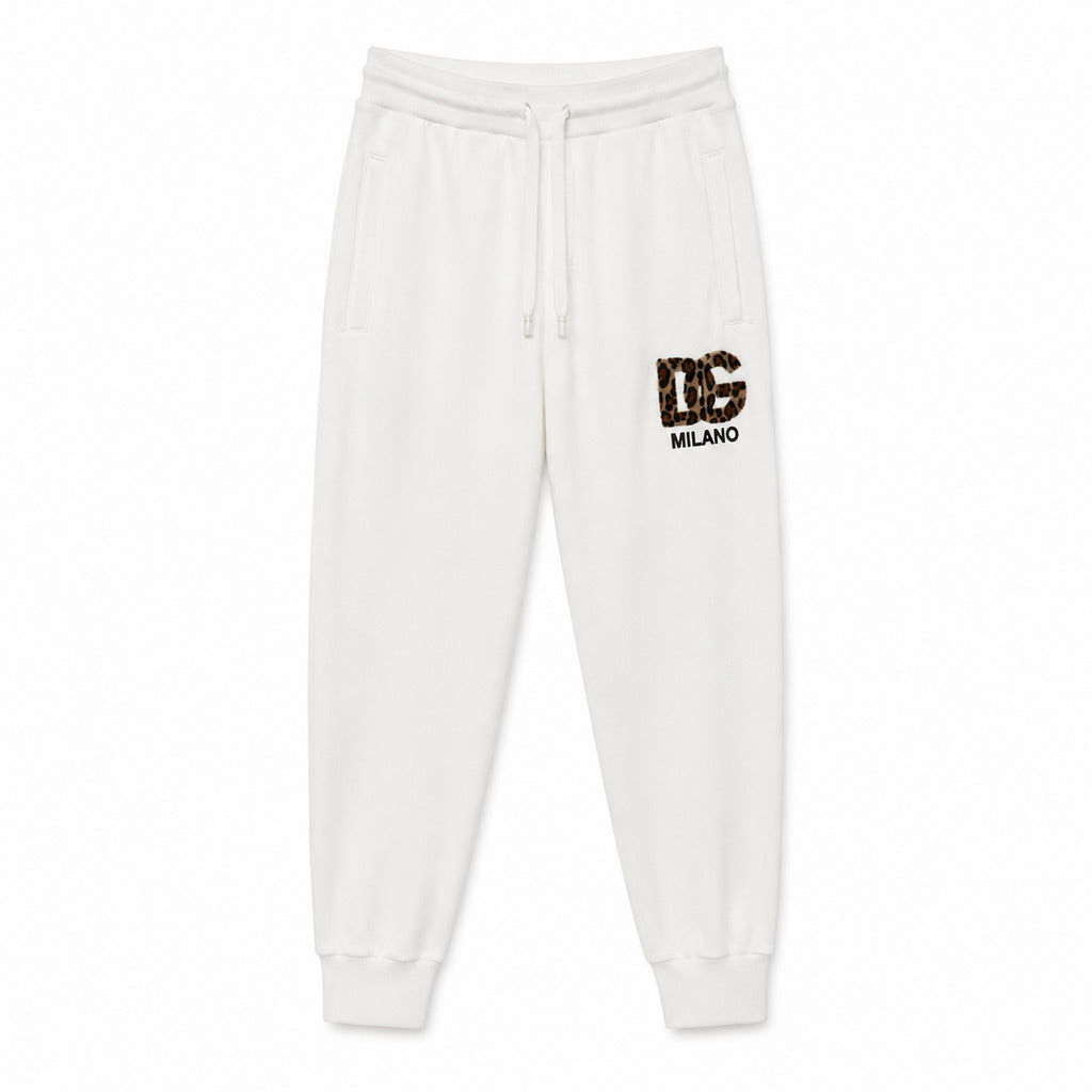 Dolce & Gabbana – white logo track pants – flat front view with leopard-print lettering
